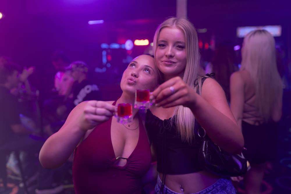 Friends sharing drinks at Spinners