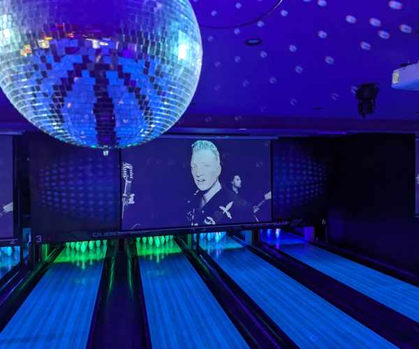 Bowling lanes with disco ball and blacklight at Spinners Bar & Bowl Maroochydore