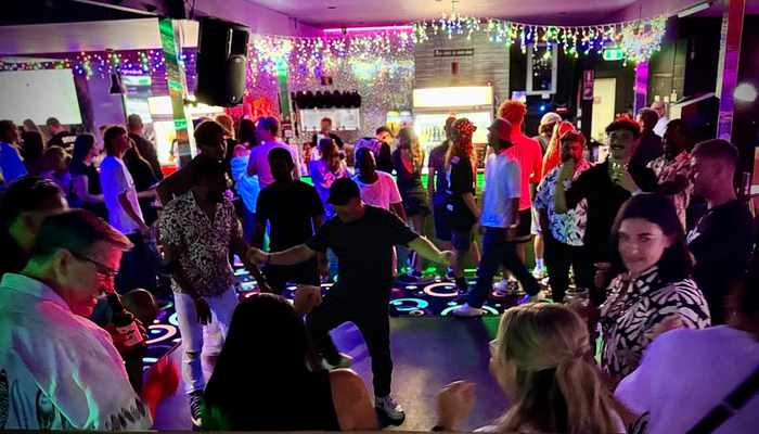 Packed dance floor at a party event at Spinners Bar & Bowl Maroochydore