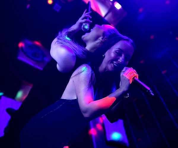 Two friends singing karaoke at Spinners Bar & Bowl Maroochydore